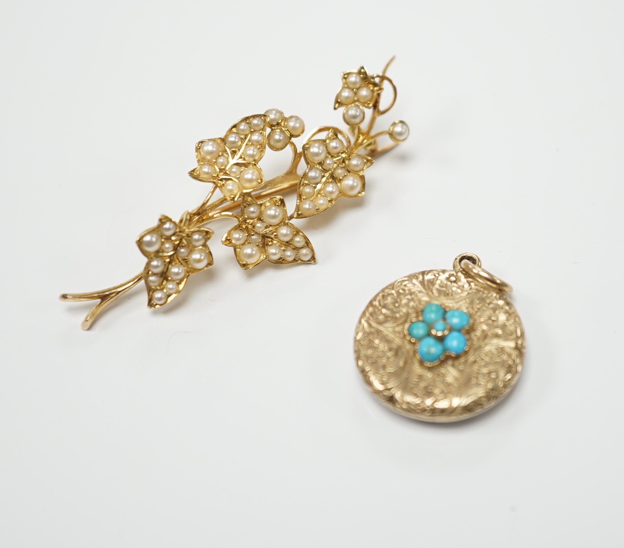 An Edwardian yellow metal and seed pearl set spray brooch, 45mm, together with a similar yellow metal and turquoise cluster set pendant with glazed back.